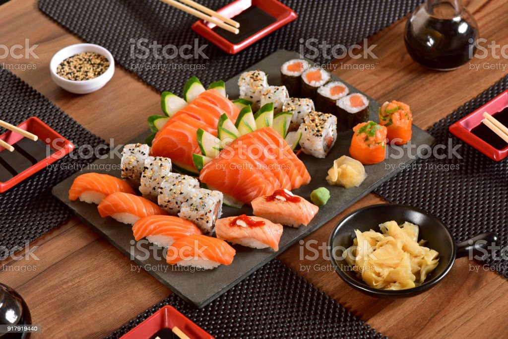 Japanese food mix on rustic board in a restaurant table